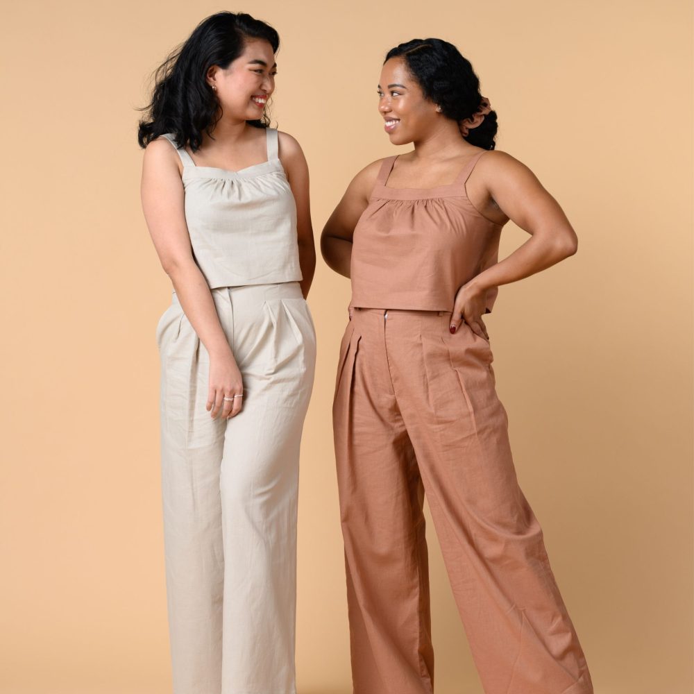 Two petite Asian models wearing jumpsets in latte and terracotta colors made by Shortlisted
